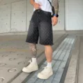 Men's American streetwear vintage washed denim shorts with all-over cross print design. - S / Black