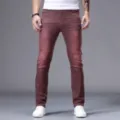 Men's classic slim fit tapered jeans in stylish burgundy color for casual daily wear and fashion. - Burgundy