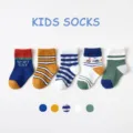 Cute cotton kids crew socks set featuring colorful striped and cartoon designs for autumn. - Cycling Sports