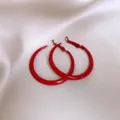Detailed close-up view of vibrant red hoop earrings, stylish minimalist accessory design. - Circle Style / 3.9cm Diameter / Red