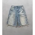 Herren hellblaue gewaschene Jeansshorts im High Street Style mit Farbklecksen und ausgefranstem Saum. - S / Denim-Blau