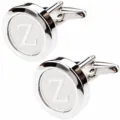 Detailed view of silver metal round cufflink with letter Z design for men dress shirts. - Letter Z