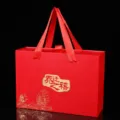 Red gold-stamped luxury gift box with ribbon handles for housewarming celebration events. - Housewarming Celebration Gift Box / Medium 23.5x17x7cm
