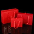 Red drawer gift boxes with ribbon handles and gold geometric patterns, perfect for packaging. - Small (17*12*5.8cm) / Red