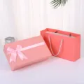 Pink gift box with ribbon bow and paper bag set for birthday party, perfume, and scarf gifts. - Gift Box & Gift Bag