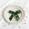 Green Christmas ribbon bow with gold foil print, displayed on white vintage plate with pearls. - Green Snowman Approx 2.5x41cm