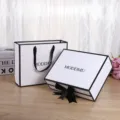 Minimalist black and white gift box and paper bag set with elegant ribbon bow for cosmetics. - Large Empty Gift Box & Gift Bag