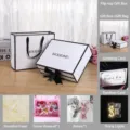 Minimalist black and white gift box set with bag, raffia, mini bouquet, rabbit and string lights. - Large Gift Box with Bag, Raffia, Card, Bouquet, String Lights & Rabbit