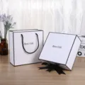 White and black gift box set with ribbon and handle, perfect for cosmetic and jewelry packaging. - Small Empty Gift Box & Gift Bag