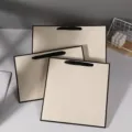 Beige paper gift bags shopping bags with black handles, elegant packaging for retail. - Blank Gift Bag / 28x29.5x4.5cm / Beige