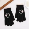 Winter knitted warm gloves featuring cute pink white heart pattern, soft and windproof daily wear. - Black