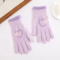 Detail view of cozy purple knitted winter gloves with cute heart pattern for daily warm wear. - Light Purple