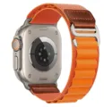 Close-up detail of the orange nylon alpine loop watch band with leather patch and metal buckle. - Orange (Silver Buckle)