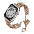 Correa de reloj de acero inoxidable para Apple Watch en oro rosa con abalorio de corazón brillante. - Rosa oro