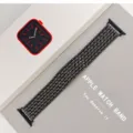 Detail view of a stylish dragon-scale metal watch band compatible with Apple Watch series. - 22mm / Black