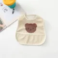 Detailed view of cute bear waterproof baby bib in beige, perfect for mess-free feeding times. - Big Face Bear