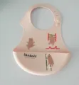 Silicone baby bib waterproof infant feeding bib with cute cartoon bear pattern detail. - Pink Pig