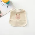 Cute waterproof baby bib with adorable cartoon animal design, easy-clean food catcher pocket. - Pink Rabbit
