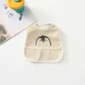 Waterproof baby bib with cute penguin design, easy to clean infant feeding apron for messy eaters. - Penguin