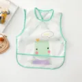 Detailed view of waterproof baby bib with cute hippo print and green trim, easy clean. - Short Sleeve Hippo