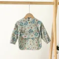 Waterproof baby long sleeve bib with pocket, cute floral pattern infant feeding smock for dining. - Size S (6-12 Months) / PU Bib with Top Pocket - Blue Flowers