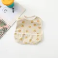 Waterproof baby bib with cute bear print and deep crumb catcher pocket detail view. - All-over Tiger Print