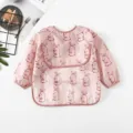 Waterproof baby long sleeve smock detail showing cute rabbit print and waterproof fabric texture. - Pink Rabbit Pattern