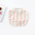 Close-up detail of cute pink and white striped baby waterproof bib with front pocket. - Pink Vertical Stripes