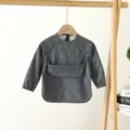 Grey long sleeve baby waterproof bib, cute cartoon face print, toddler feeding apron. - Size S (6-12 Months) / PU Bib with Top Pocket - Gray Smiley