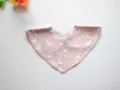 Detailed view of soft cotton baby triangle bib with cute duck pattern and snap button. - Goose