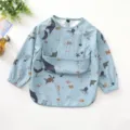 Details of the waterproof baby long-sleeve feeding bib featuring cute ocean animal prints. - Size L (24-36 Months) / PU Bib with Top Pocket - Blue Ocean