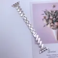 Detailed close-up view of the metallic Z-shaped Moebius watch strap replacement accessory. - Starlight