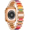 Details of the rose gold smartwatch with colorful resin metal strap showcasing back sensor. - Rose Gold + Rainbow