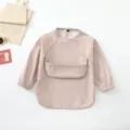 Waterproof baby long sleeve smock bib in light pink, perfect for toddler eating and painting. - Size S for 6-12 Months / Dusky Pink