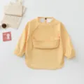 Baby waterproof long sleeve smock bib with catch pocket in yellow for feeding time. - Size S for 6-12 Months / Yellow