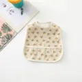 Waterproof baby bib with cute lemon pattern, easy-clean infant feeding apron detail. - All-Over Little Lemon