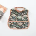 Waterproof baby bib with vintage floral print, pink trim and convenient food catcher pocket. - Peony