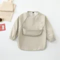Beige waterproof long-sleeve baby dining bib, perfect for messy meals and art play. - Size S for 6-12 Months / Apricot
