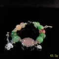 Crystal gemstone beaded bracelet with silver charms, detailed view of exquisite craft. - Green Flower