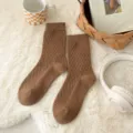 Brown vintage argyle knit mid-calf socks detail shot showing cozy winter texture. - One Size / Coffee