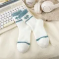 Cozy fluffy women winter warm mid-tube socks with cute blue bow pattern and soft fleece texture. - One Size / Blue