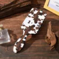 Cow print paddle hair brush with air cushion massage design for daily scalp care and anti static styling. - Style C Black and White Cow Print