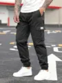 Men's black cargo pants with multiple pockets, slim fit casual trousers for daily wear. - S / Black