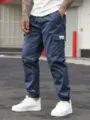 Men's dark blue multi-pocket cargo pants, slim fit casual trousers for summer daily wear. - S / Navy Blue