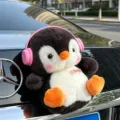 Cute penguin plush toy with pink headphones and love tag for car trunk or interior decoration. - Penguin