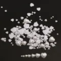 Detail shot of multi-size heart flat-back pearl patches, ABS imitation beads for DIY crafts. - 3mm, 200 Pcs / Pure White