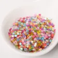Close-up detail of 3mm colorful star sequins glitter, perfect for nail art and DIY epoxy crafts. - Multicolor