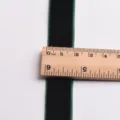Dark green velvet ribbon detail close up showing width with a wooden ruler for DIY crafts. - 19mm (1m) / Dark Green