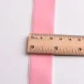 Pink velvet ribbon detail view showing width measurement with a wooden ruler for DIY crafts. - 25mm (1 Meter) / Light Pink