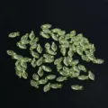 Detail shot of green leaf beads for DIY jewelry making, ideal for handmade necklaces and bracelets. - 50 Pieces/Pack / #5 Pale Green